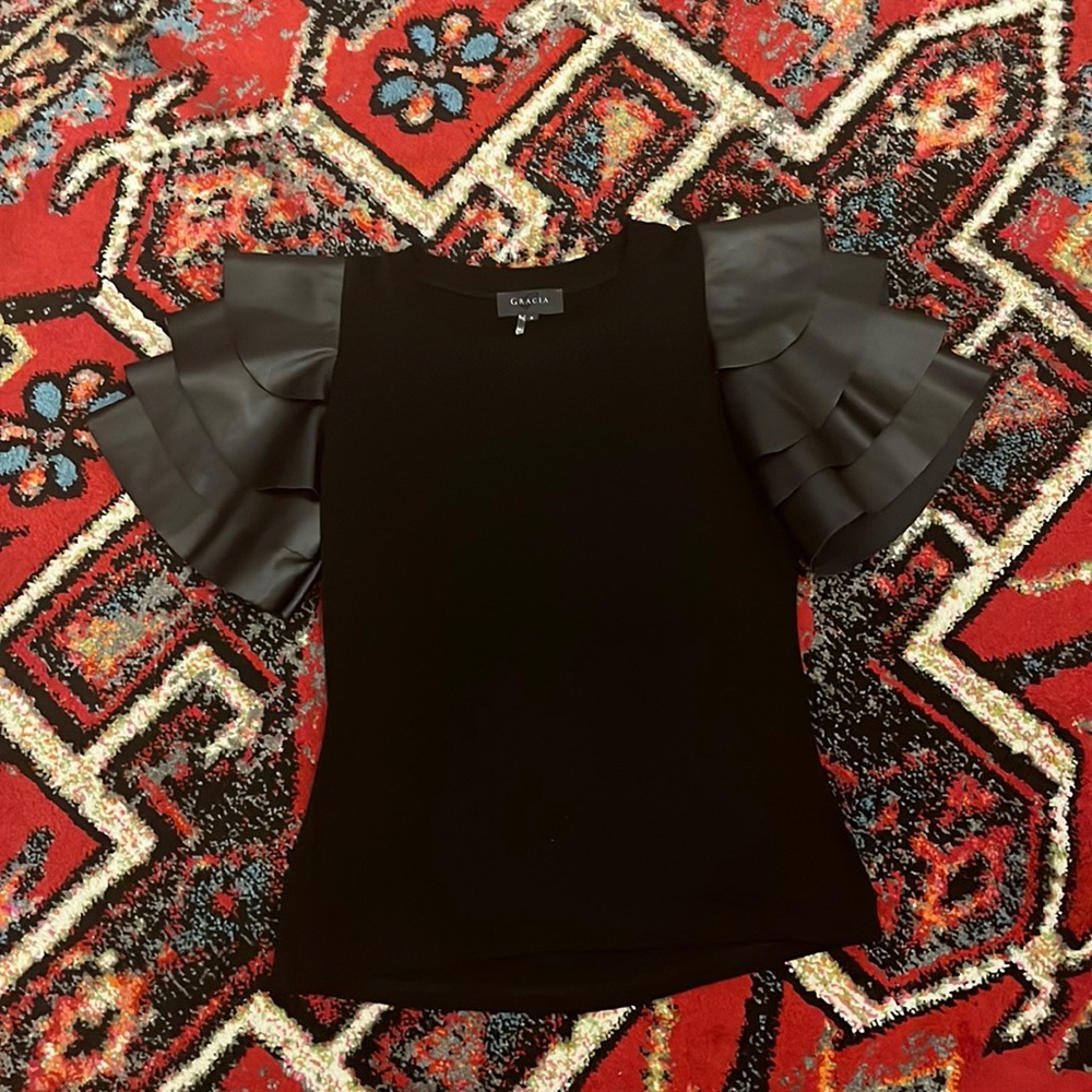 Black small top with leather sleeves